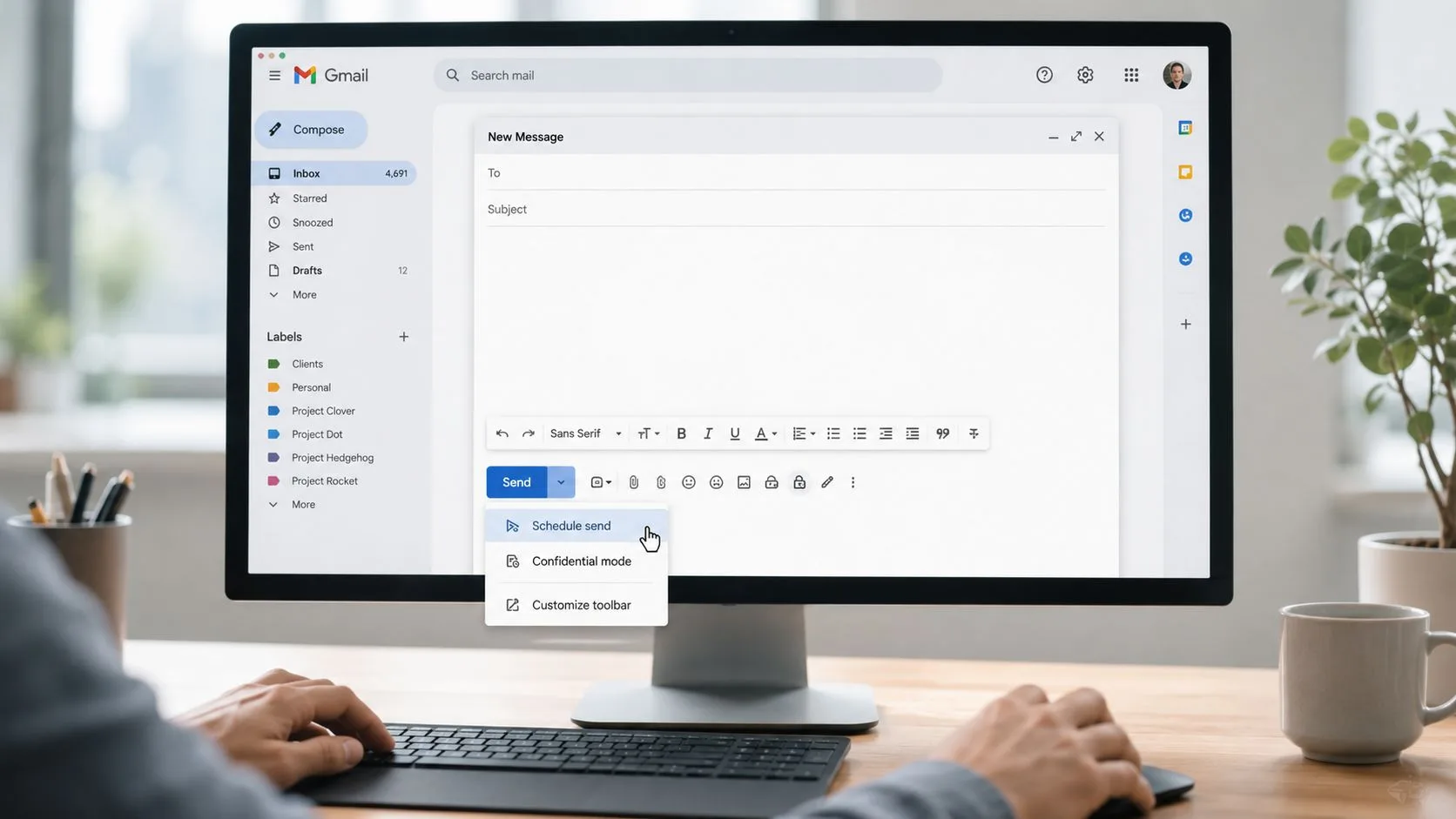 A person using a computer to access the Gmail interface and select the schedule send email option.