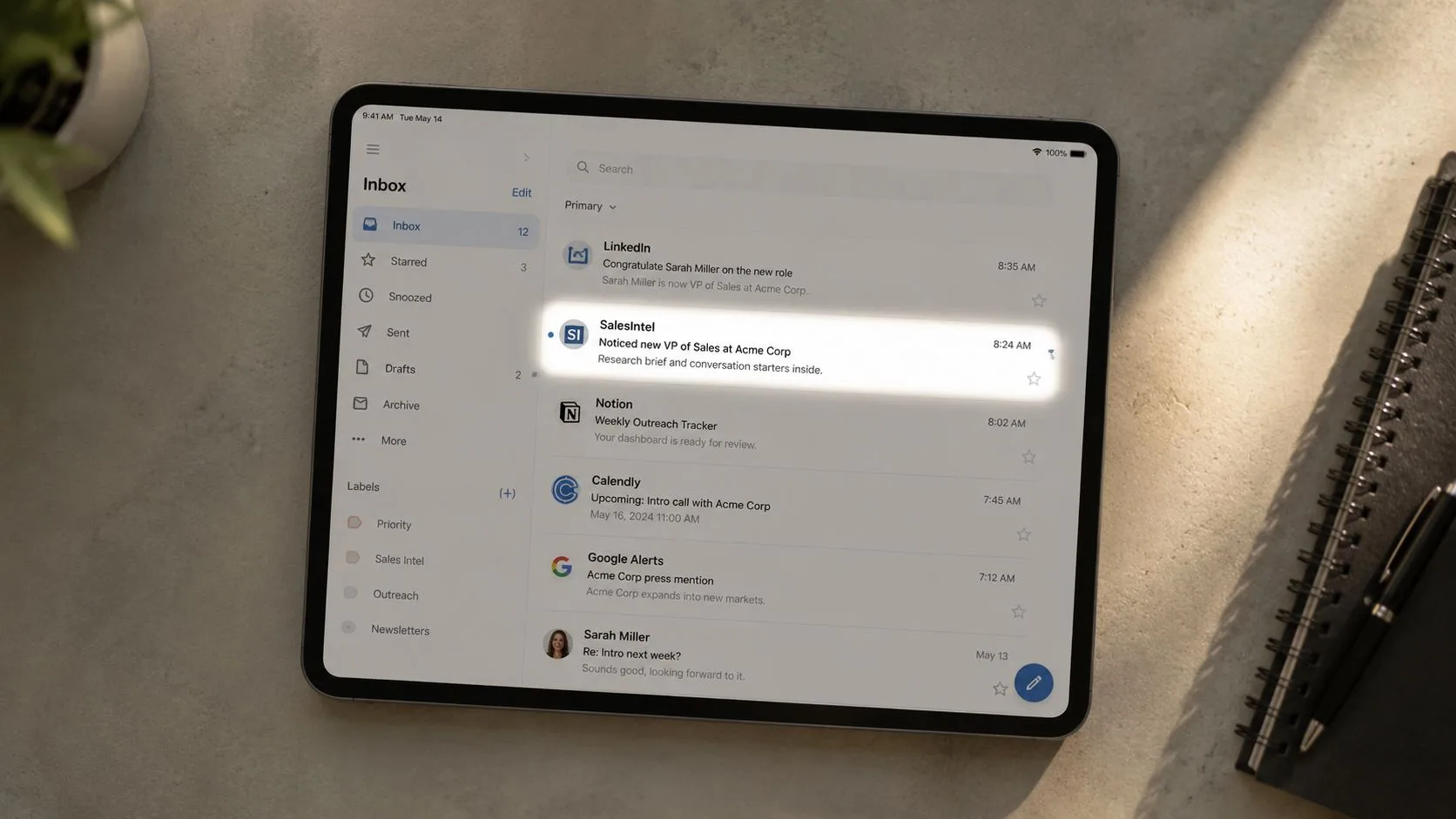 A digital tablet displaying an email inbox interface with a highlighted SalesIntel notification about a new lead.